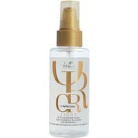 Clear bottle of Wella Professionals Oil Reflections Light with gold pump and reflective label design.