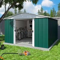 Green and white Yardmaster metal shed, 10' x 13', with double sliding doors, set on grass with garden tools nearby.