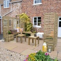 Modular wooden garden seating set with slatted panels, benches, and planters on a patio near a brick house.