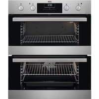 Stainless steel AEG built-under double oven with black glass doors and control knobs, featuring two spacious cavities.