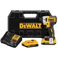 Yellow and black DeWalt impact driver with two batteries, charger, and black carrying case.