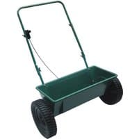 Green Handy THDS 27kg drop spreader with large black wheels and a metal handle.