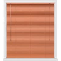 Orange Venetian blinds with white frame, featuring a pull cord on the left side.