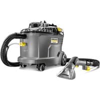 Gray Kärcher Puzzi 8/1 carpet cleaner with transparent nozzle, black hose, and yellow accents.