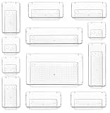 Clear Stackzy drawer organiser set, 12-piece, various sizes, transparent plastic trays for makeup or kitchen storage.