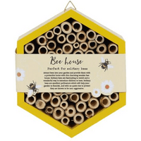 Hexagonal wooden bee house with bamboo tubes, yellow frame, and decorative bee and flower illustrations.