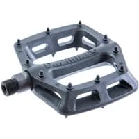 Black DMR V6 plastic pedal with textured surface, multiple grip pins, and durable axle for bicycles.