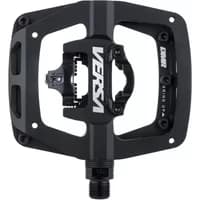 Black DMR Versa bike pedal with dual-sided design, platform on one side, clipless mechanism on the other, and white logo.