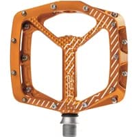 Orange Hope F22 flat pedal with textured surface, silver pins, and geometric cutouts for cycling.