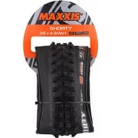 Black Maxxis Shorty folding tyre with knobby tread, orange and black packaging, labeled MT EXO/TR.
