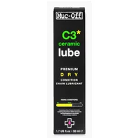 Muc-Off C3 Dry Ceramic Lube 50ml bottle, black with green and white text, pink accents, and precision nozzle.