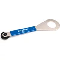 Silver Park Tool BBT9 with blue handle, featuring a circular wrench and toothed gear for HollowTech II bottom brackets.