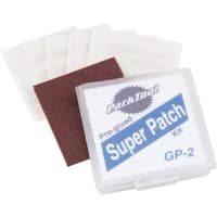 Clear plastic case with Park Tool Super Patch Kit label, includes adhesive patches and sandpaper square.