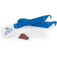 Blue Park Tool tyre levers with patch kit and sandpaper square.