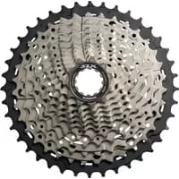 Silver Shimano Deore XT M8000 11-speed cassette with 11-46T range, featuring a black center and intricate gear design.