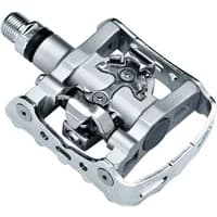 Silver Shimano M324 SPD touring pedal with clip-in mechanism and flat platform, durable metal construction.