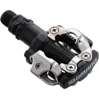 Black Shimano M520 SPD MTB pedal with silver clipless mechanism and durable metal body.