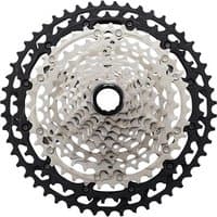 Shimano XT M8100 12 Speed Cassette with silver and black sprockets, intricate gear pattern, and central hub.