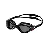 Black Speedo swimming goggles with smoke lenses, adjustable strap, and sleek design for comfort and anti-fog protection.