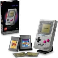 LEGO Game Boy model kit with gray bricks, pink buttons, and game cartridges, displayed with packaging box.