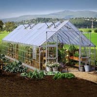 Silver Palram Canopia Balance greenhouse with clear panels, peaked roof, and spacious interior for plants.
