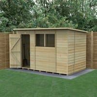 Wooden pent shed with shiplap cladding, single door, and two windows, set on a concrete base in a garden.