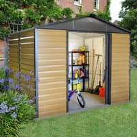 Brown and gray metal shed with open door, revealing shelves, tools, and a bicycle inside, surrounded by garden greenery.