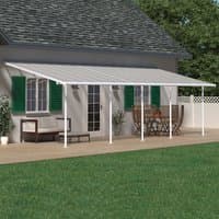 White 10x30 Palram Canopia Sierra patio cover with clear panels and white frame attached to a house.