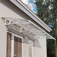White mist Palram Canopia Bordeaux canopy with clear panels and elegant arched design over double wooden doors.