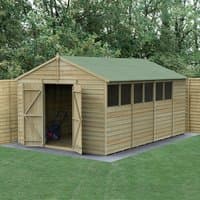Wooden shed with double doors, apex roof, pressure-treated overlap panels, and multiple windows, set in a garden.