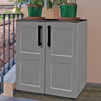 Gray Shire plastic garden storage cupboard with black handles, two doors, and shelves, topped with potted plants.