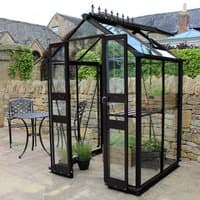 Black Halls Cotswold Birdlip greenhouse, 4' x 4', with toughened glass panels and decorative roof finials.