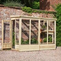 Wooden lean-to greenhouse with clear panels, open back, and slanted roof, set against a brick wall.