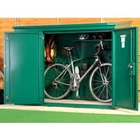 Green metal bike shed with double doors, housing a bicycle, helmets, and gear on shelves, measuring 6' x 3'.