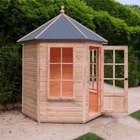 Hexagonal wooden gazebo with large windows, open door, and pointed roof, set in a garden area.