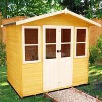 Wooden summerhouse with yellow panels, white trim, double doors, and four windows, set in a garden.