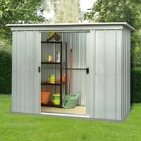 Silver Yardmaster Pent Metal Shed, 8' x 4', with sliding doors and vertical grooves, set in a grassy garden.