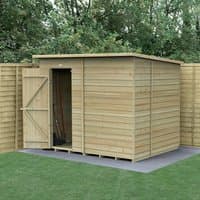 Wooden shed, 8'x6', windowless, overlap pressure-treated panels, pent roof, natural finish, set on grass.