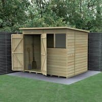Wooden shed with double doors, shiplap cladding, and a pent roof, set on a concrete base with garden tools inside.
