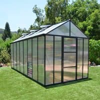 8x16 Palram Canopia Glory Greenhouse with clear panels, black frame, and roof vents on a grassy lawn.