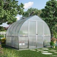 Silver Palram Canopia Bella greenhouse with curved roof, clear panels, and metal frame in a garden setting.