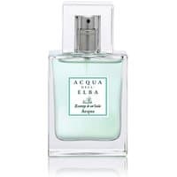 Clear glass bottle with light blue liquid, silver spray cap, and Acqua dell'Elba label for unisex marine perfume.