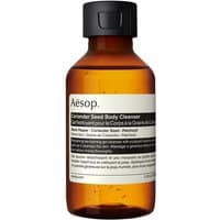 Amber bottle of Aesop Coriander Seed Body Cleanser with black cap and white label, 100 ml size.