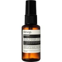 Aesop deodorant spray in amber bottle with black spray cap and white label, 50 ml size.