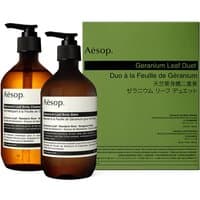 Aesop Geranium Leaf Duet, two amber pump bottles, black caps, green box packaging, 500 ml each, cleansing body kit.