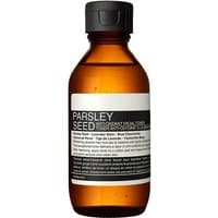 Amber bottle of Aesop Parsley Seed Anti-Oxidant Facial Toner with black cap and white label detailing product information.