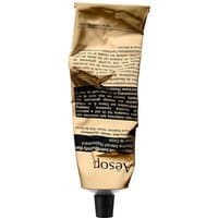 Aesop Rejuvenate Intensive Body Balm in a crumpled gold tube with black text and black screw cap, 100 ml size.