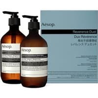 Aesop Reverence Duet: two amber pump bottles with black labels, blue box packaging in background.