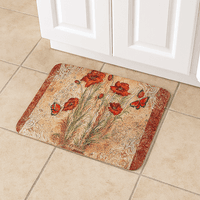 Anti-Fatigue Mat by Avilo, beige with red poppy flowers and butterfly design, placed on tiled floor.