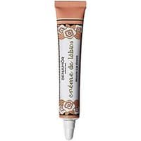 Benamor lip balm in a floral-decorated tube with a peach cap and white applicator tip.